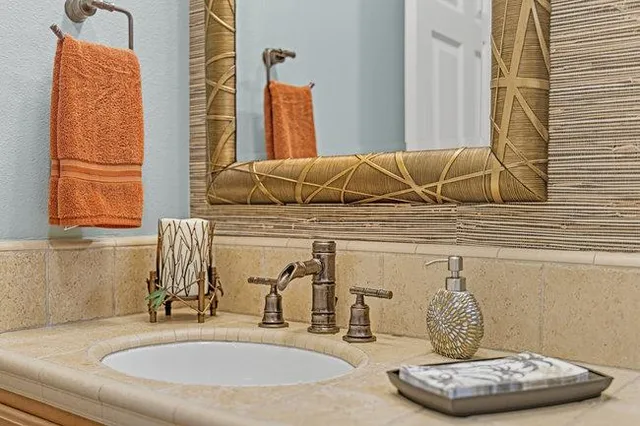 a bathroom with a tub sink and a window