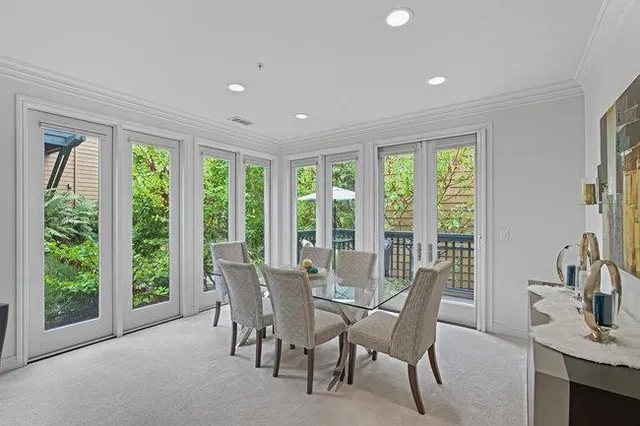 a view of a dining room with furniture and window