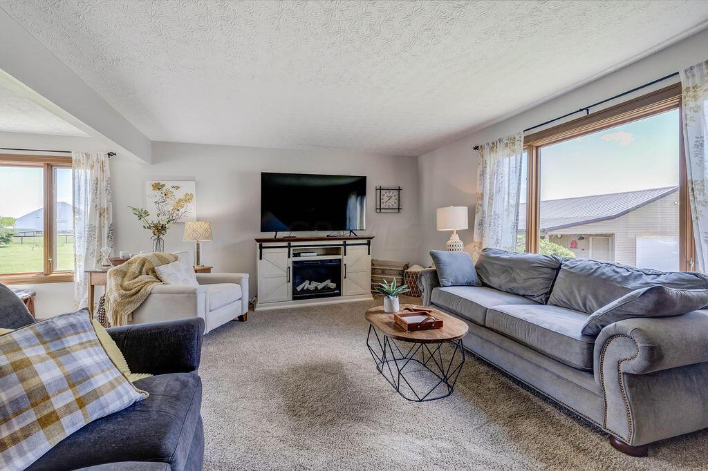 1300 Hubbard Road Galloway, OH 43119 - Photo 6 of 89 • New light sand carpet ~ 2016 • Grey painted walls • Drapes are negotiable • New Pella® windows ~ 2021