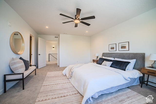 342 Perrine Drive Midvale, UT 84047 - Photo 18 of 37 Recessed lighting, ceiling fan, white paneled doors, carpeted flooring, and modern iron railing