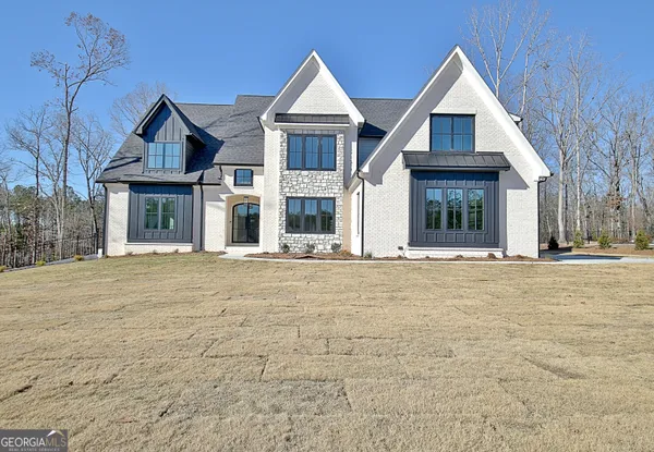 a front view of a house with a yard