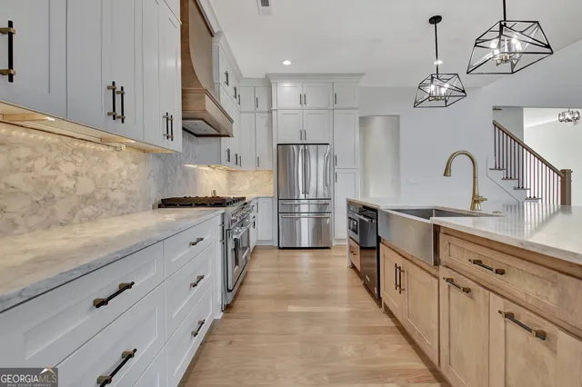 a kitchen with kitchen island granite countertop stainless steel appliances lots of counter top space