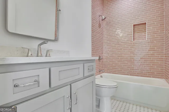 a bathroom with a sink a toilet and a bathtub