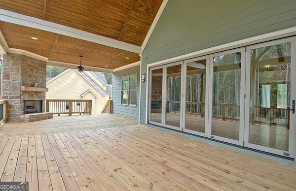 a view of porch with wooden floor