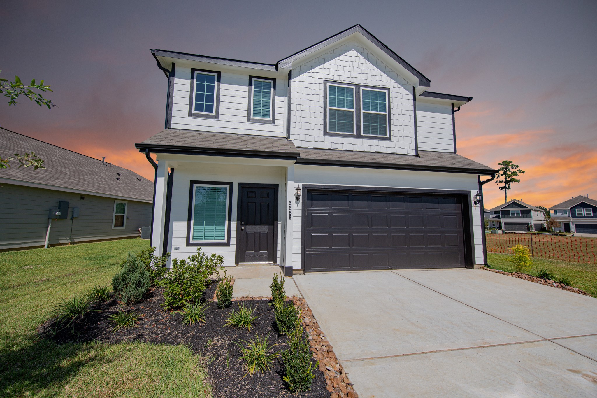 a front view of a house with garden
