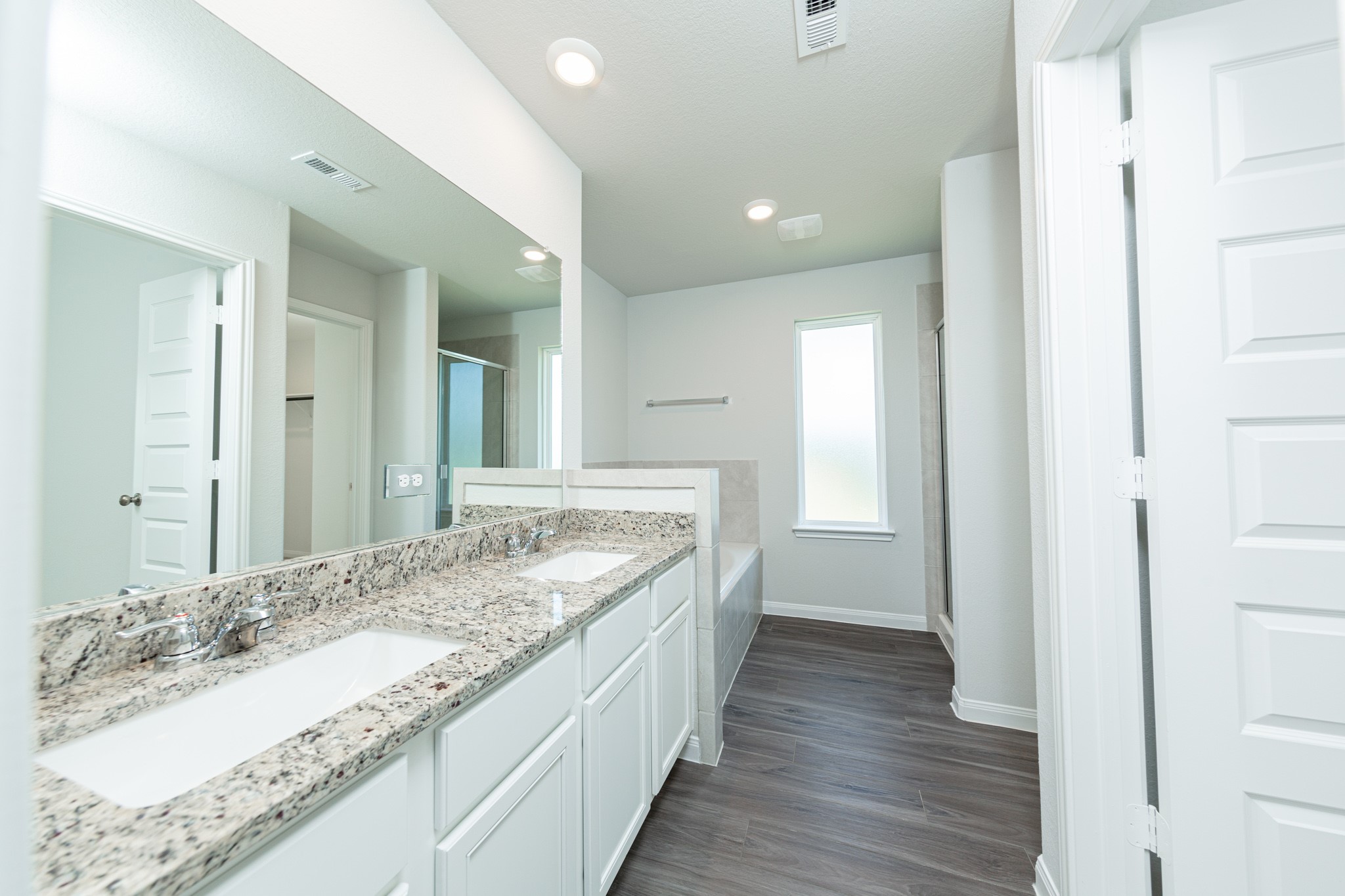 2259 Middle Rdg Drive Conroe, TX 77301 - Photo 11 of 20 a bathroom with a granite countertop double vanity sink and a mirror