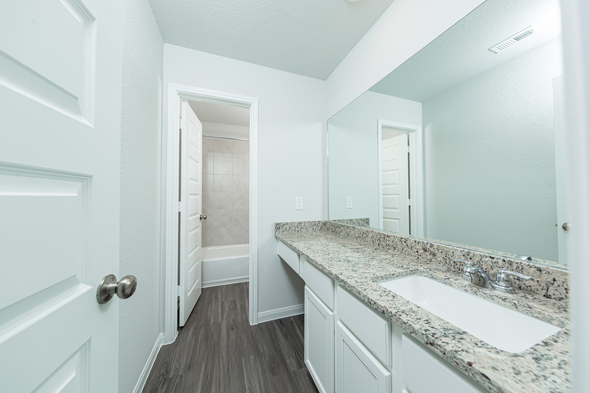 2259 Middle Rdg Drive Conroe, TX 77301 - Photo 14 of 20 a bathroom with a granite countertop sink a toilet and shower