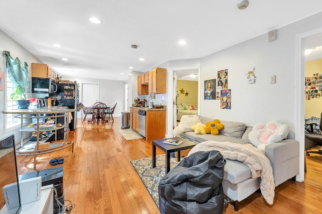 22 Fisher Avenue, Unit 1 Boston, MA 02120 - Photo 3 of 8 a living room with furniture and wooden floor
