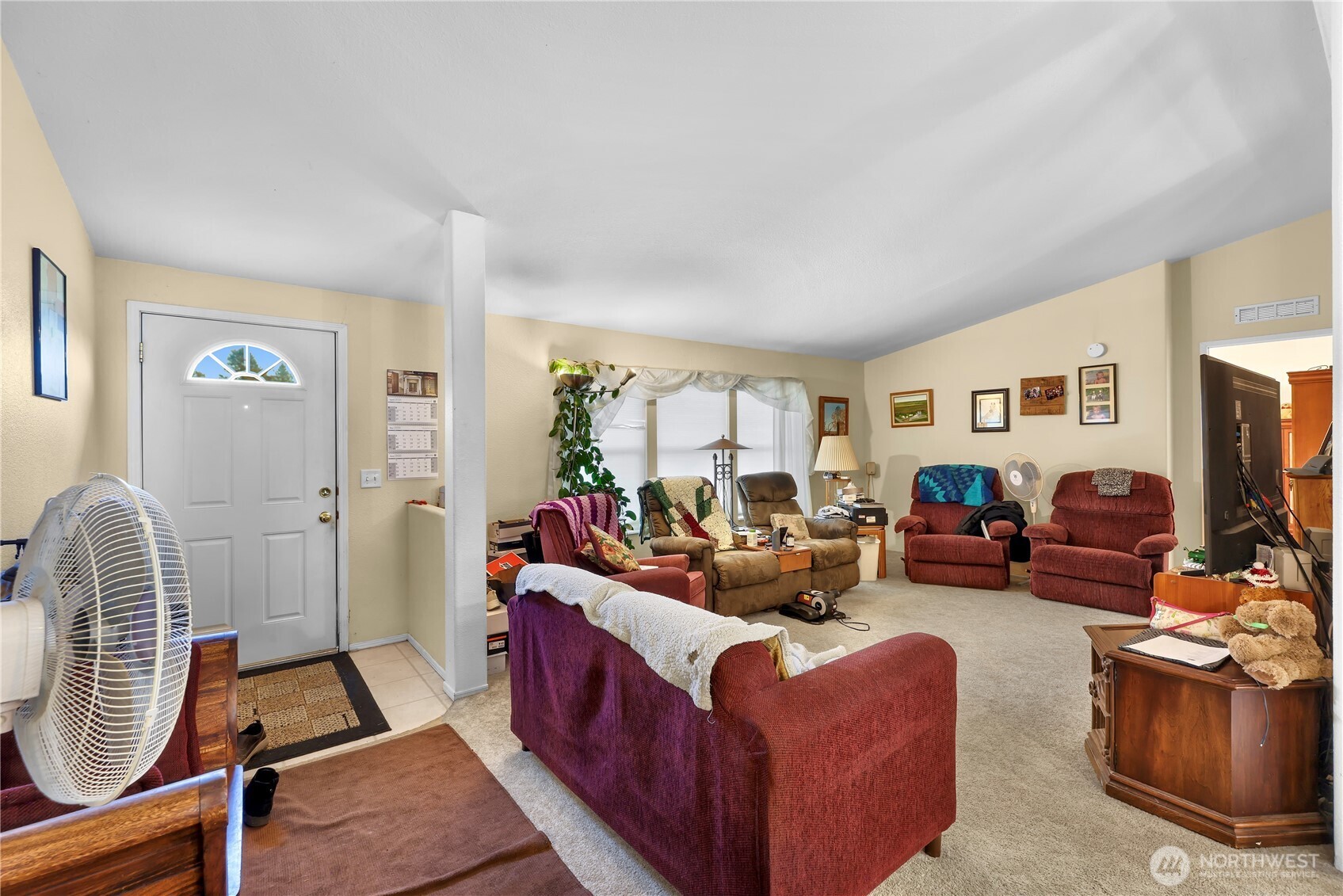 7928 Portal Way Custer, WA 98240 - Photo 5 of 39 a living room with furniture a flat screen tv and a window