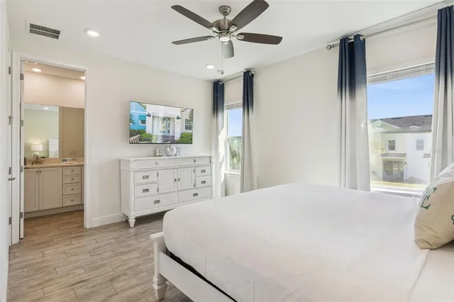 a bedroom with a bed and a dresser