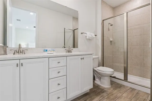 a room with a bed and a chandelier