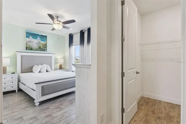 a bedroom with a large bed and a window