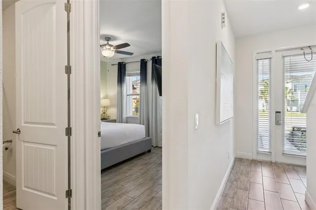 a bedroom with a large bed and a window