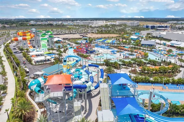 an aerial view of residential building and lake