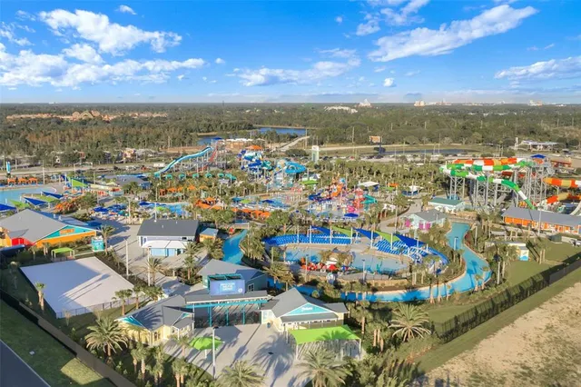 a view of swimming pool with outdoor seating and city view