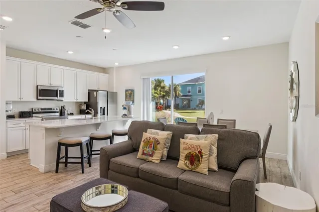 a kitchen with stainless steel appliances a stove microwave and sink
