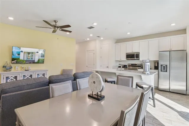 a living room with furniture and painting on the wall