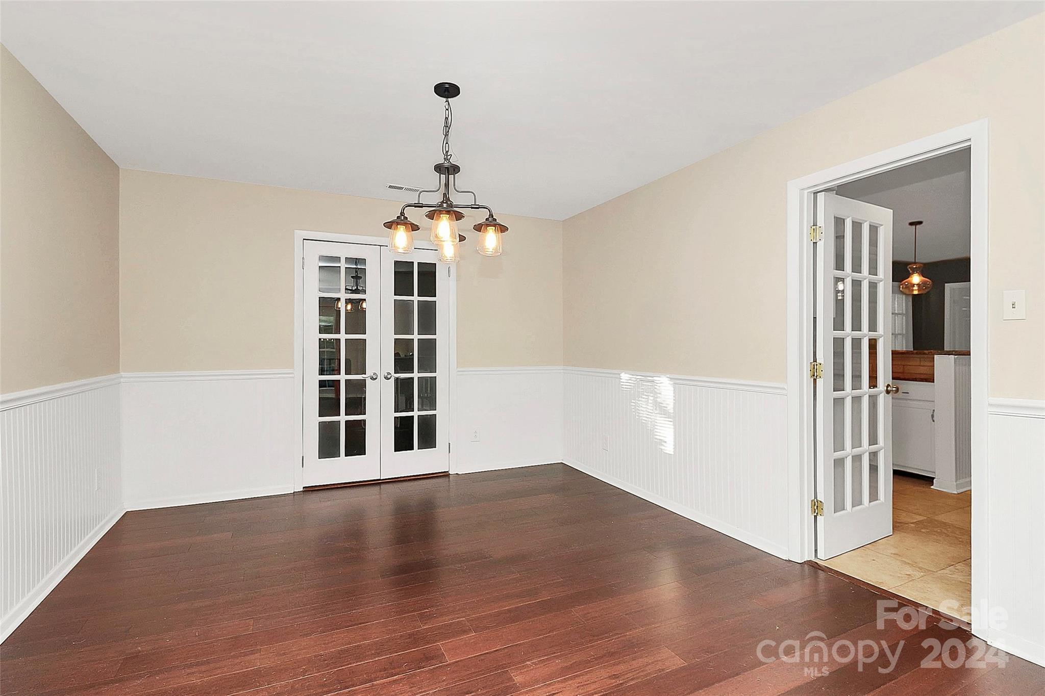 623 Trail Ridge Road Matthews, NC 28105 - Photo 17 of 38 a view of empty room with wooden floor and window
