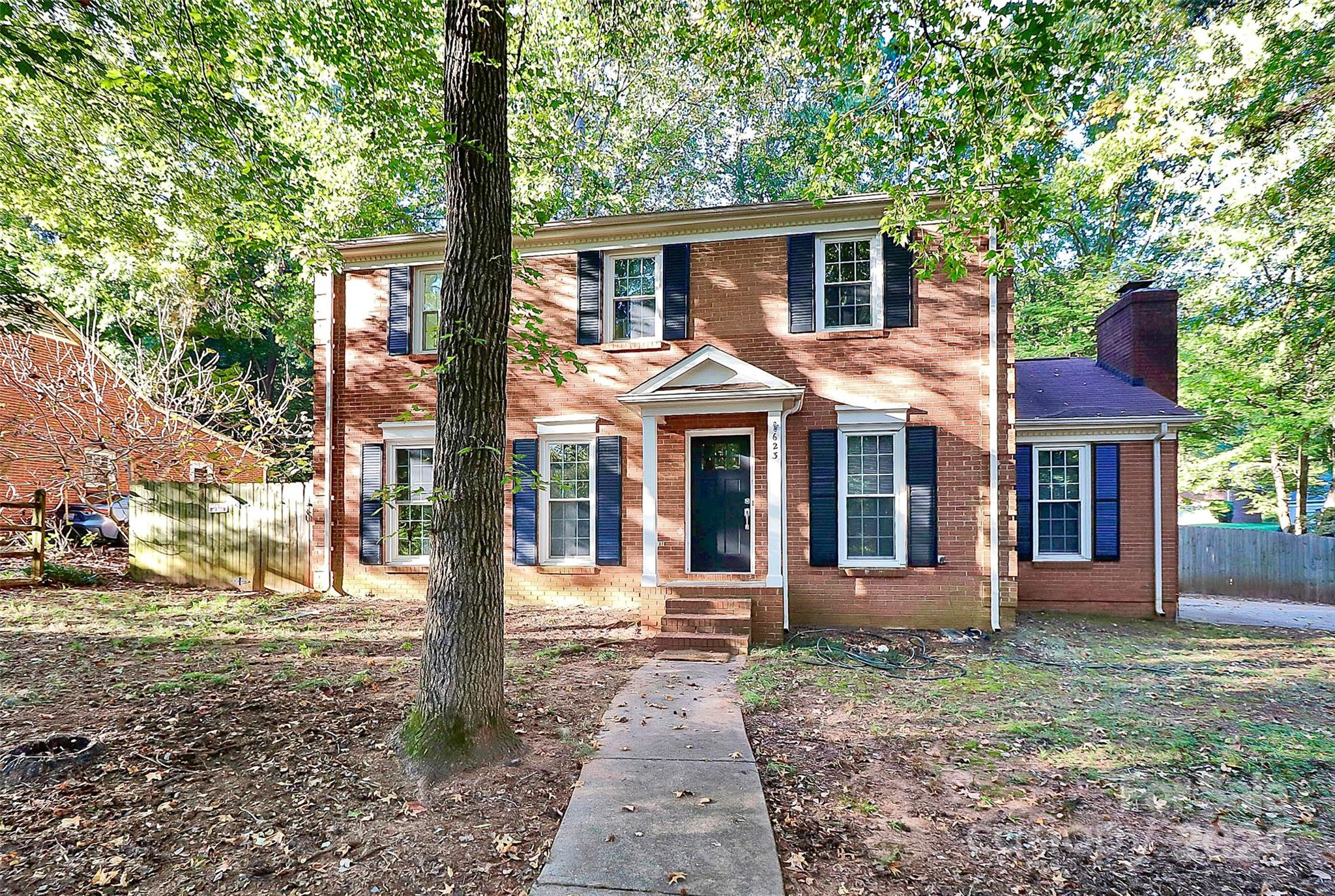 623 Trail Ridge Road Matthews, NC 28105 - Photo 2 of 38 a front view of a house with a porch