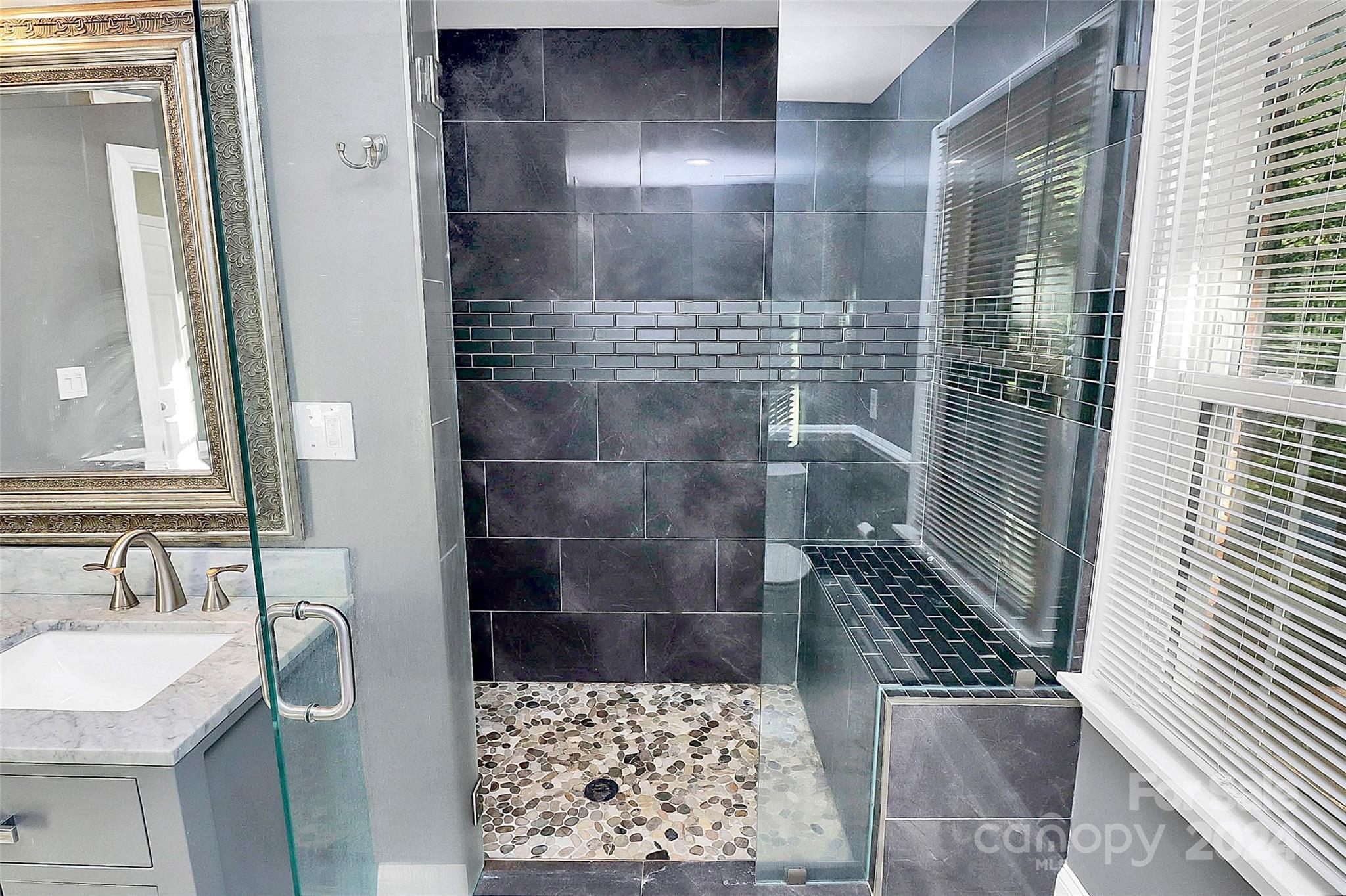 623 Trail Ridge Road Matthews, NC 28105 - Photo 21 of 38 a bathroom with a sink a toilet and shower