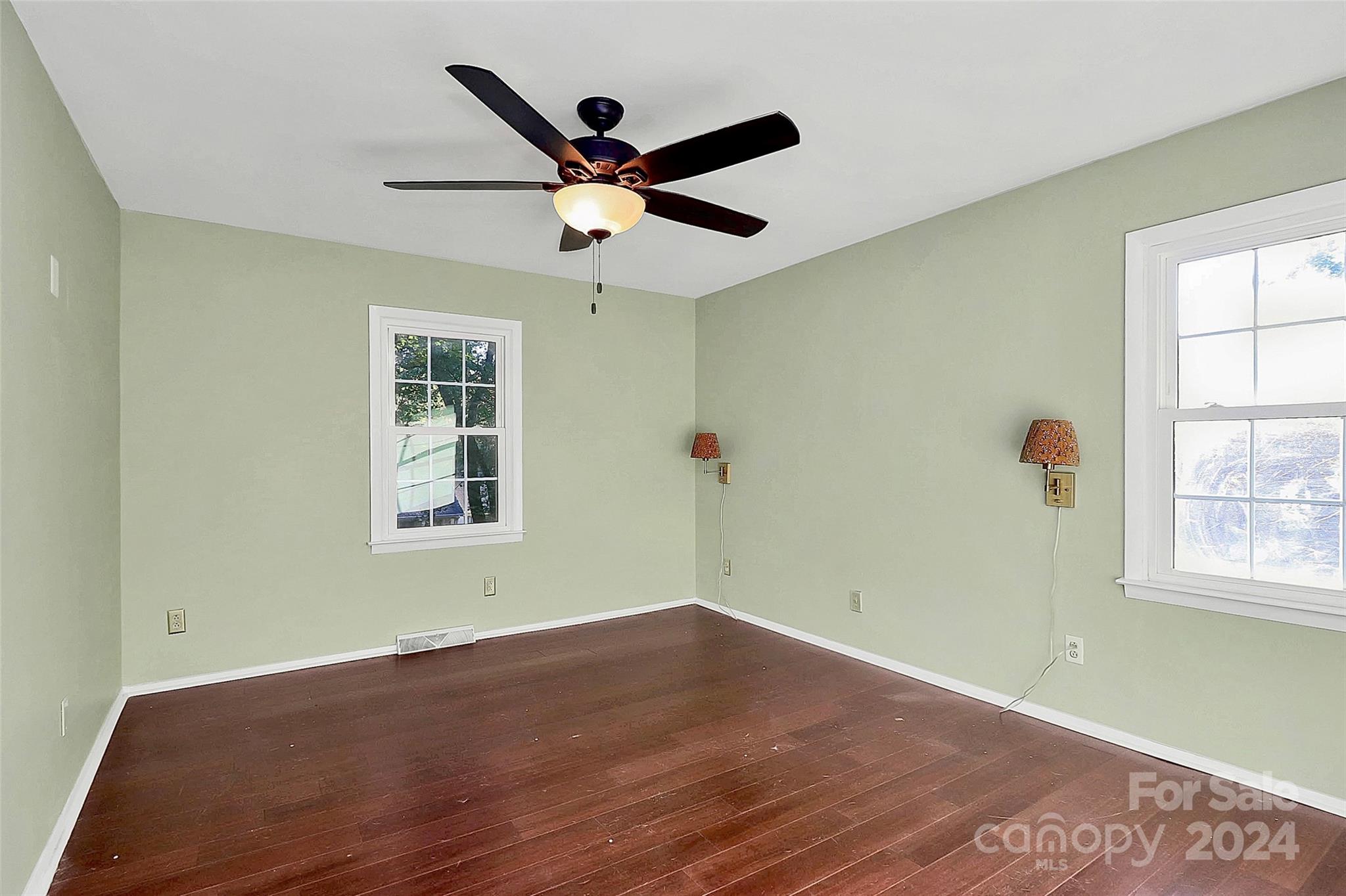 623 Trail Ridge Road Matthews, NC 28105 - Photo 25 of 38 a view of a big room with wooden floor and windows