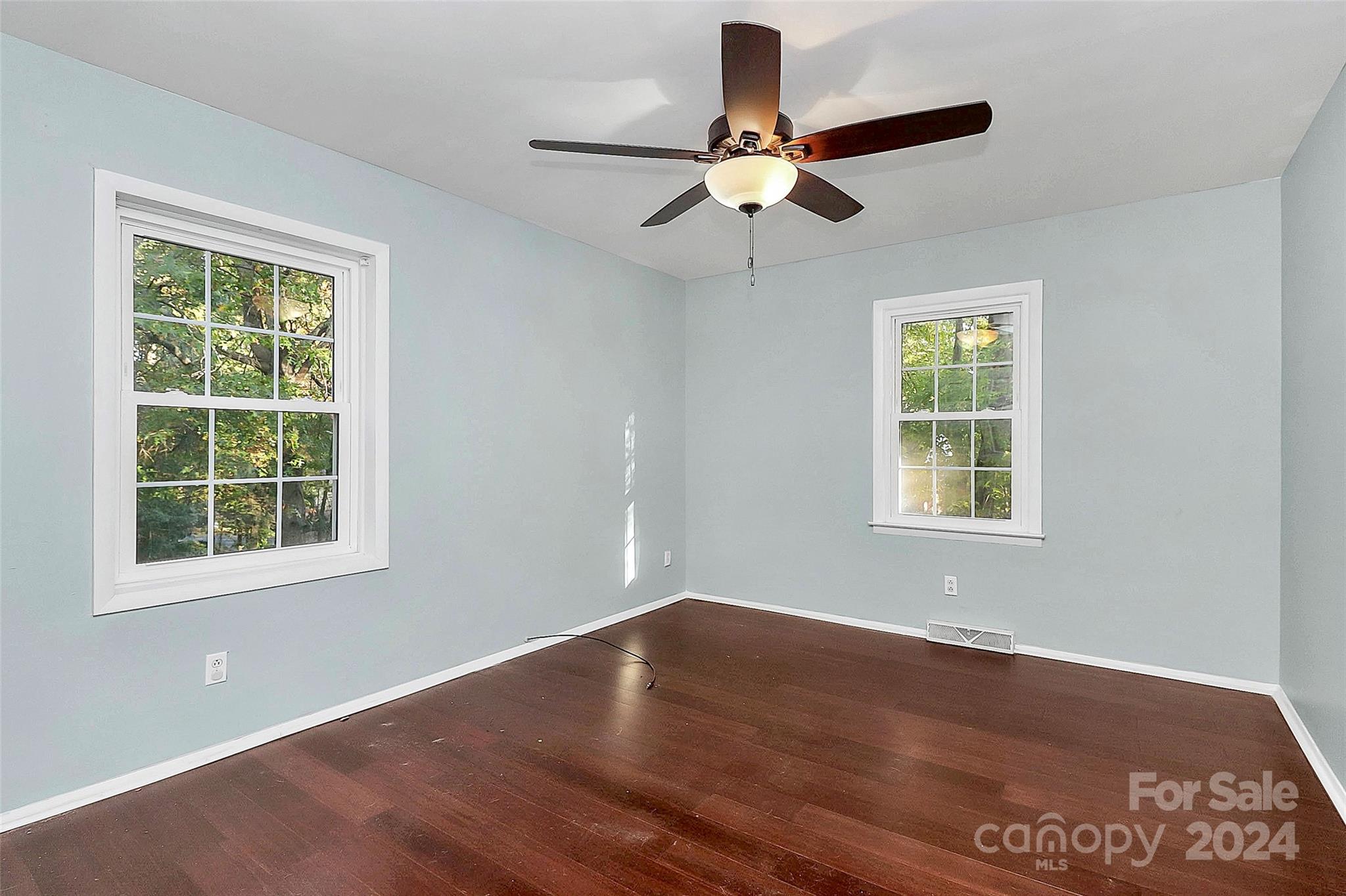 623 Trail Ridge Road Matthews, NC 28105 - Photo 28 of 38 a view of an empty room with wooden floor and a window