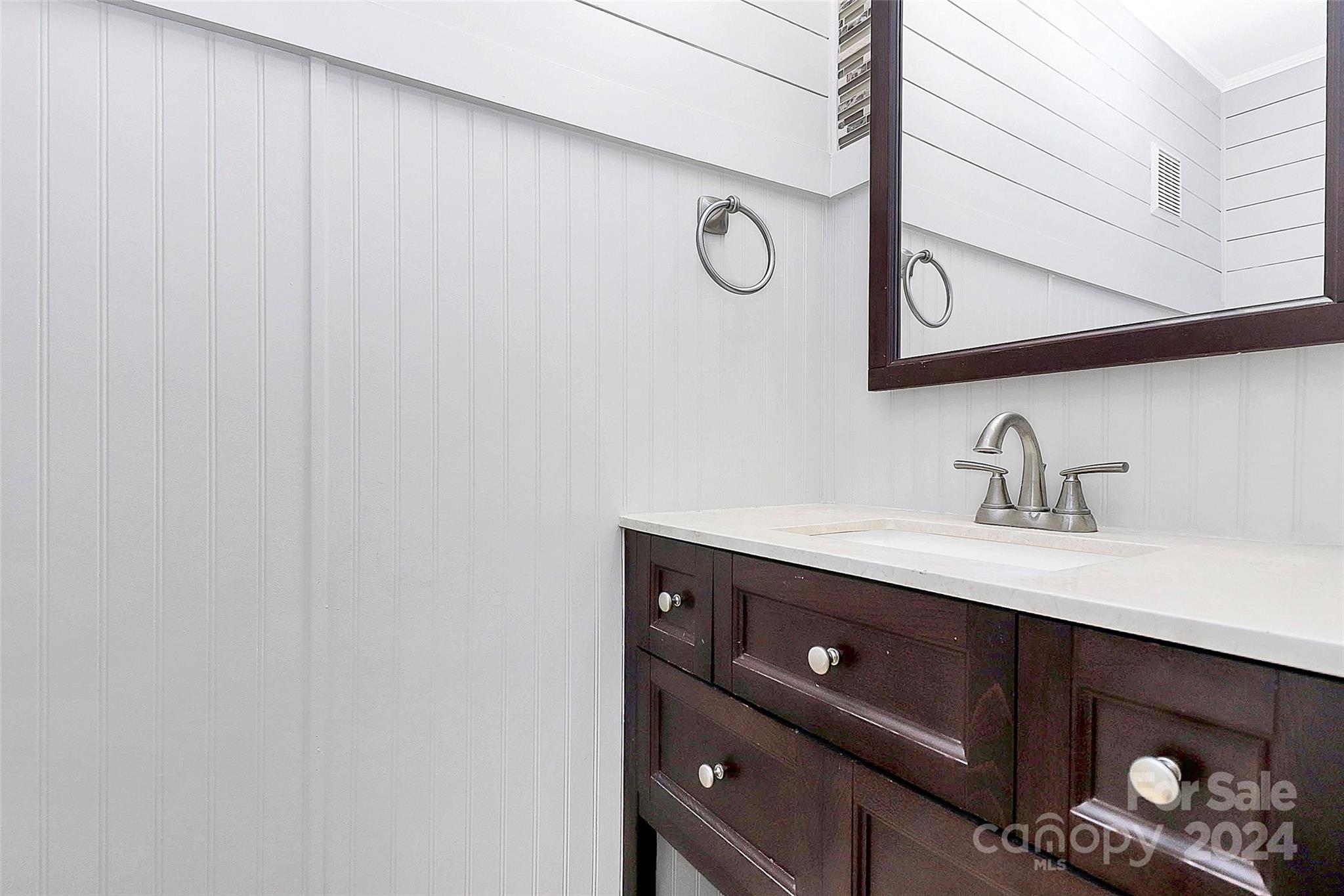623 Trail Ridge Road Matthews, NC 28105 - Photo 32 of 38 a bathroom with a sink and a mirror