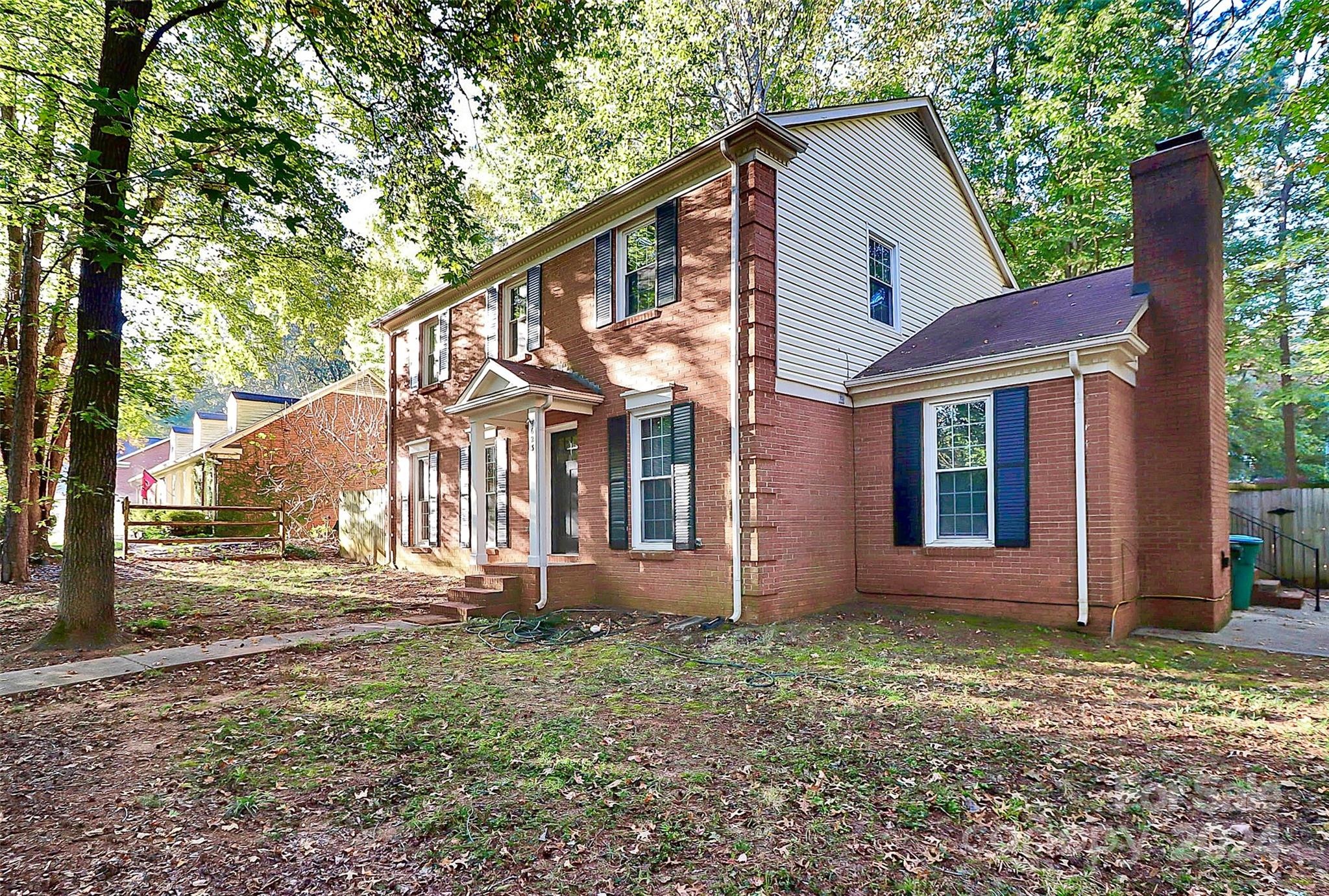 623 Trail Ridge Road Matthews, NC 28105 - Photo 4 of 38 a front view of a house with garden
