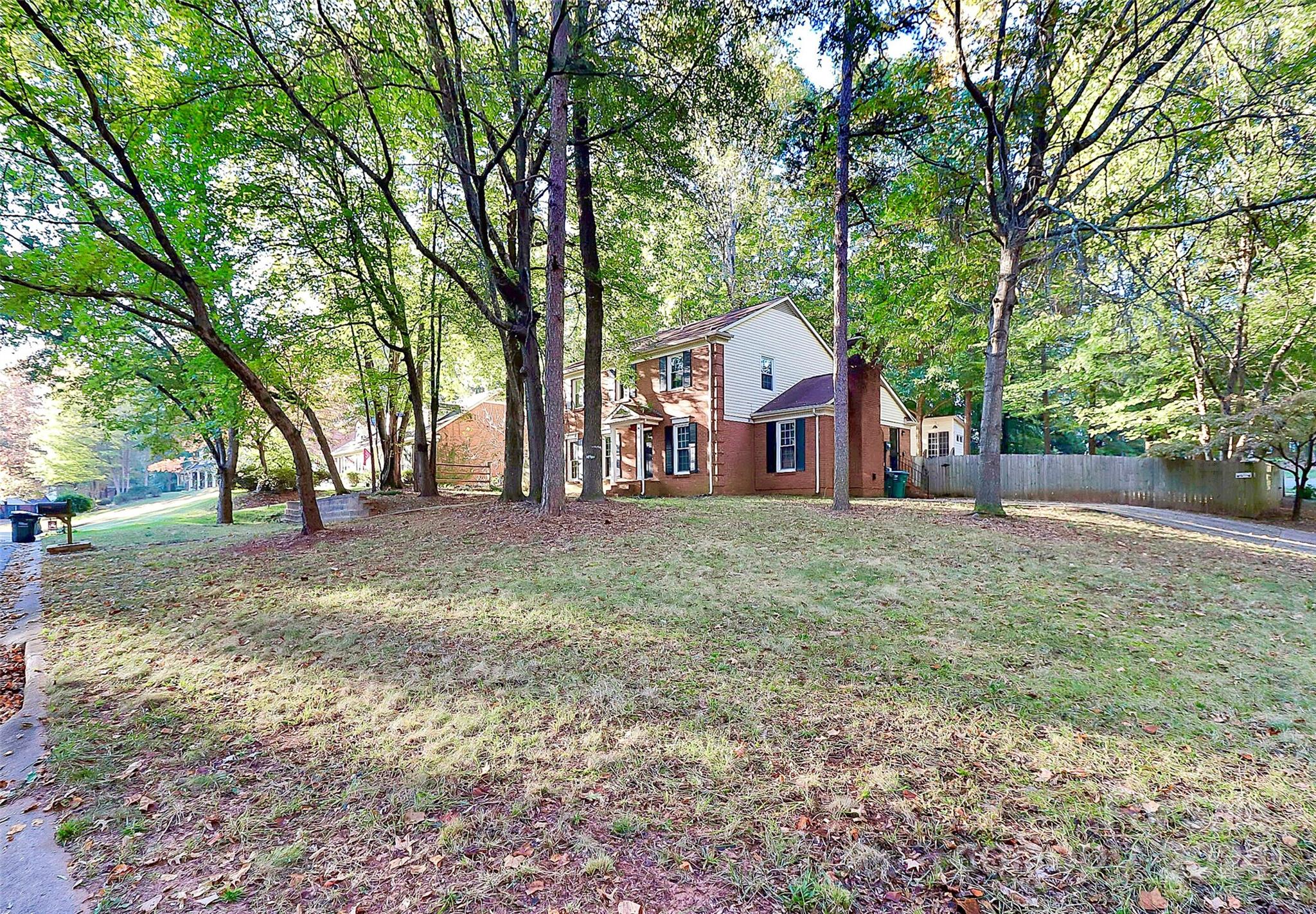 623 Trail Ridge Road Matthews, NC 28105 - Photo 5 of 38 a view of a house with yard and tree s