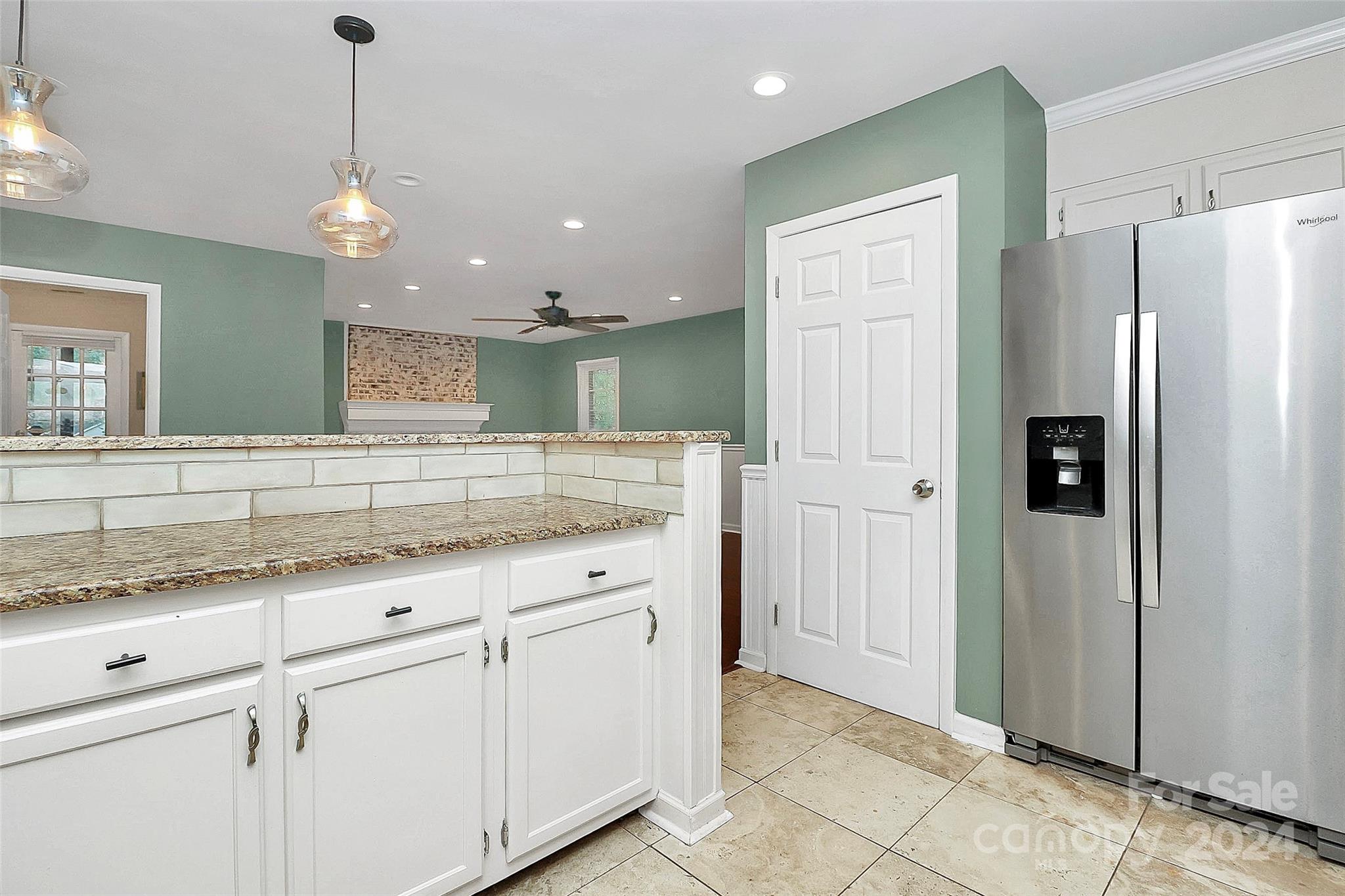 623 Trail Ridge Road Matthews, NC 28105 - Photo 8 of 38 a bathroom with a granite countertop sink and a refrigerator