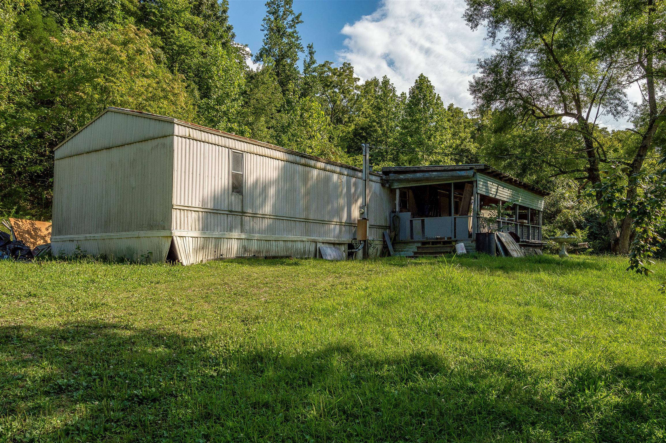 2233 Peach Road Minor Hill, TN 38473 - Photo 11 of 30 a backyard of a house with lots of green space