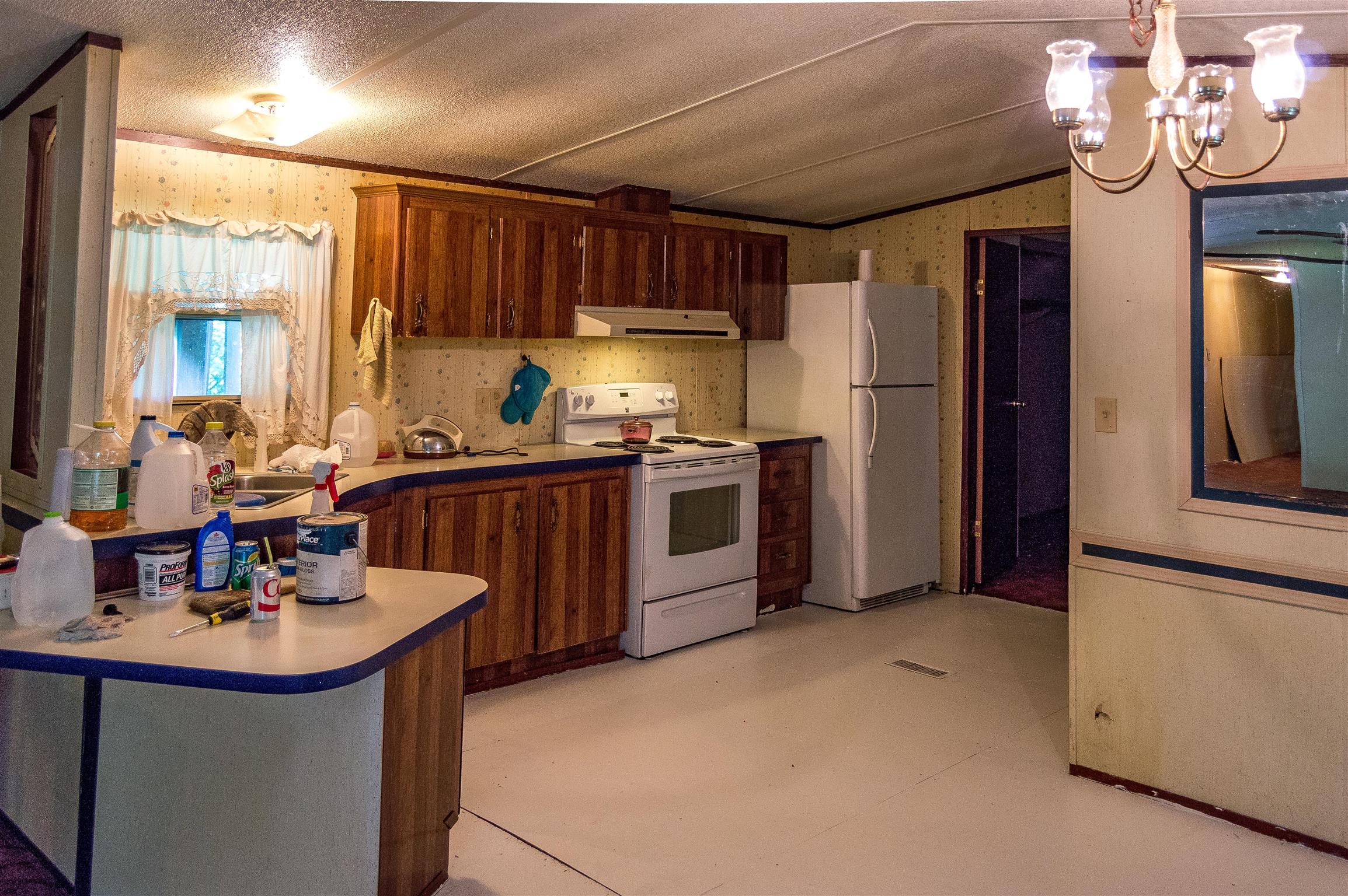 2233 Peach Road Minor Hill, TN 38473 - Photo 14 of 30 a kitchen with stainless steel appliances a sink a refrigerator and a stove
