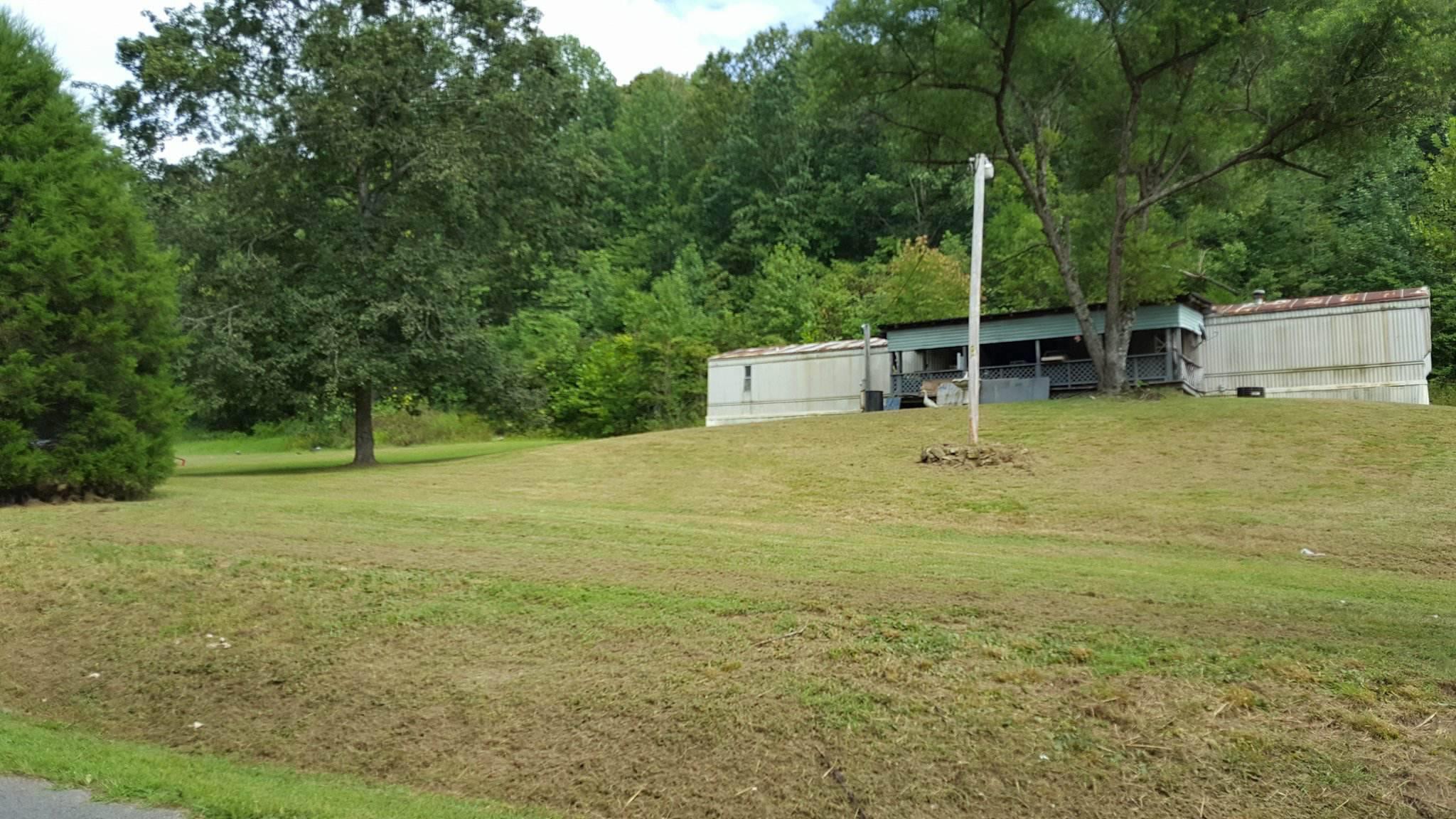 2233 Peach Road Minor Hill, TN 38473 - Photo 10 of 30 a view of a garden with a bench