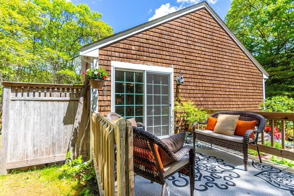 848 Cotuit Road Mashpee, MA 02649 - Photo 23 of 28 a view of outdoor sitting area with furniture and wooden deck