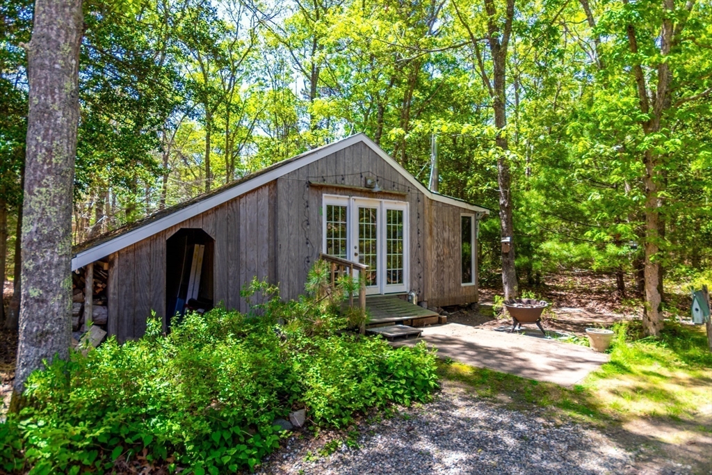 848 Cotuit Road Mashpee, MA 02649 - Photo 26 of 28 a backyard of a house with seating space