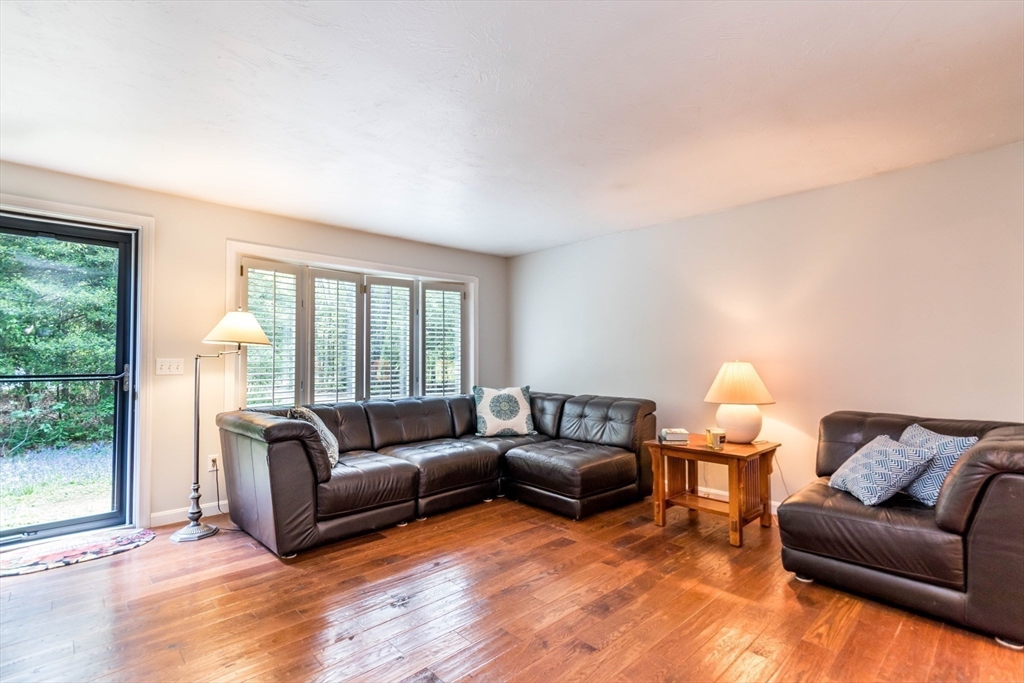 848 Cotuit Road Mashpee, MA 02649 - Photo 7 of 28 a living room with furniture window and a lamp