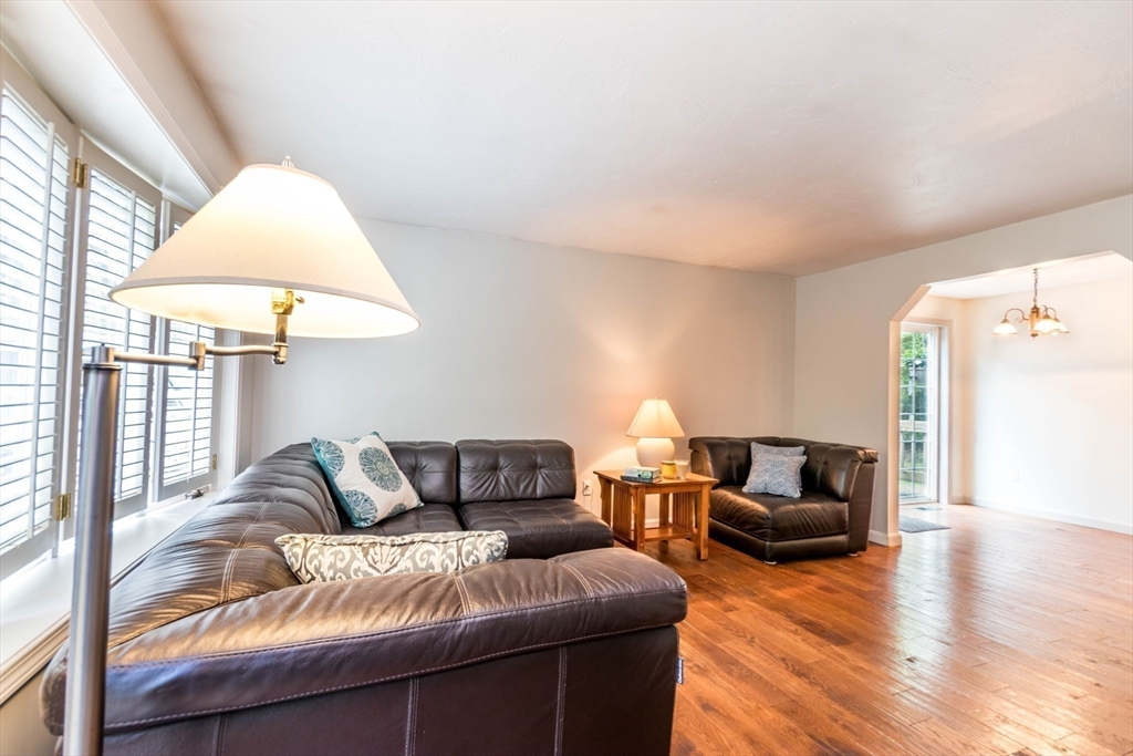 848 Cotuit Road Mashpee, MA 02649 - Photo 8 of 28 a bedroom with furniture and a lamp