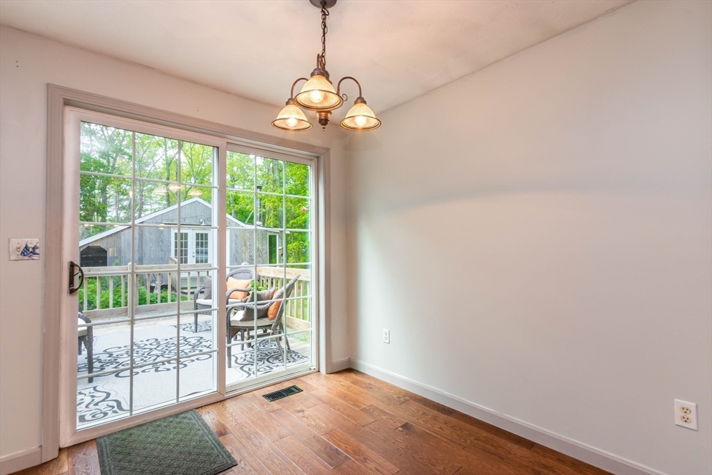 848 Cotuit Road Mashpee, MA 02649 - Photo 10 of 28 a view of a room with wooden floor and balcony