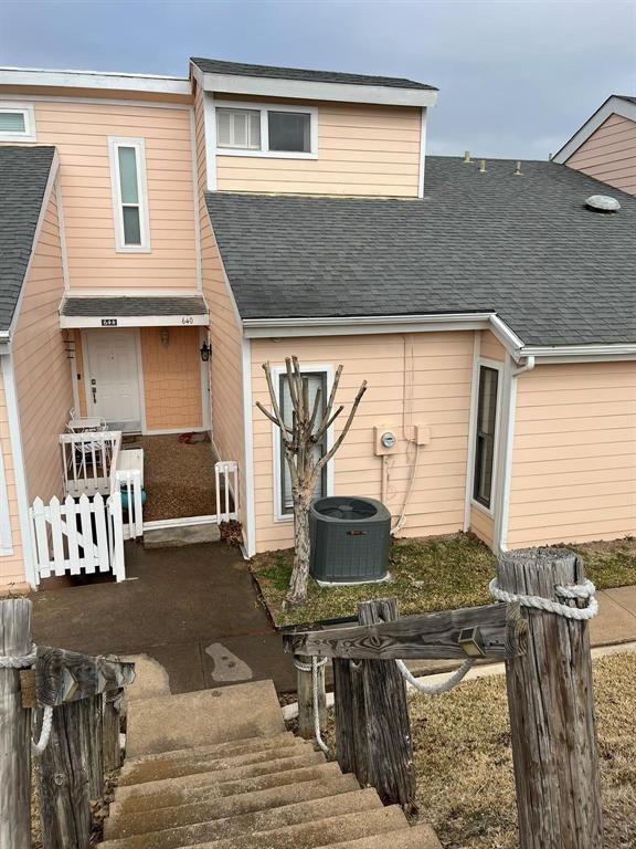 640 Harbor Drive Azle, TX 76020 - Photo 1 of 33 a view of a patio with table and chairs and wooden floor