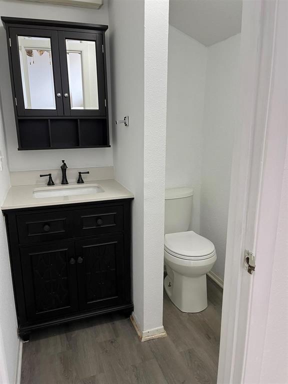 640 Harbor Drive Azle, TX 76020 - Photo 25 of 33 a bathroom with a toilet sink and mirror