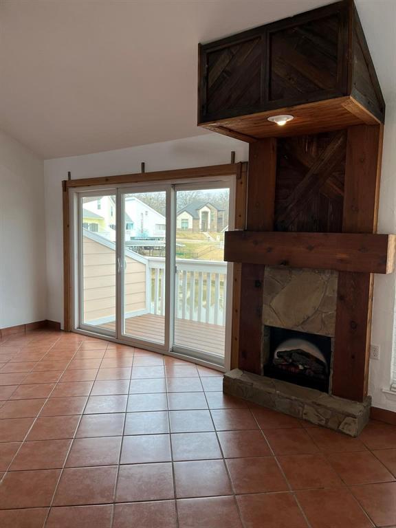 640 Harbor Drive Azle, TX 76020 - Photo 6 of 33 a view of an empty room with a fireplace and a window
