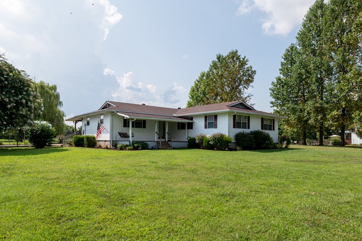 3945 Mitchell Road Lebanon, TN 37087 - Photo 2 of 41 a front view of a house with a yard and trees