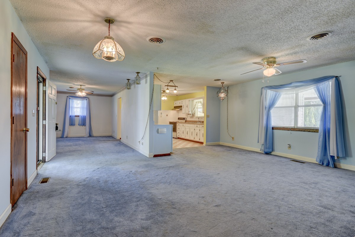 3945 Mitchell Road Lebanon, TN 37087 - Photo 16 of 41 an empty room with chandelier fan and windows