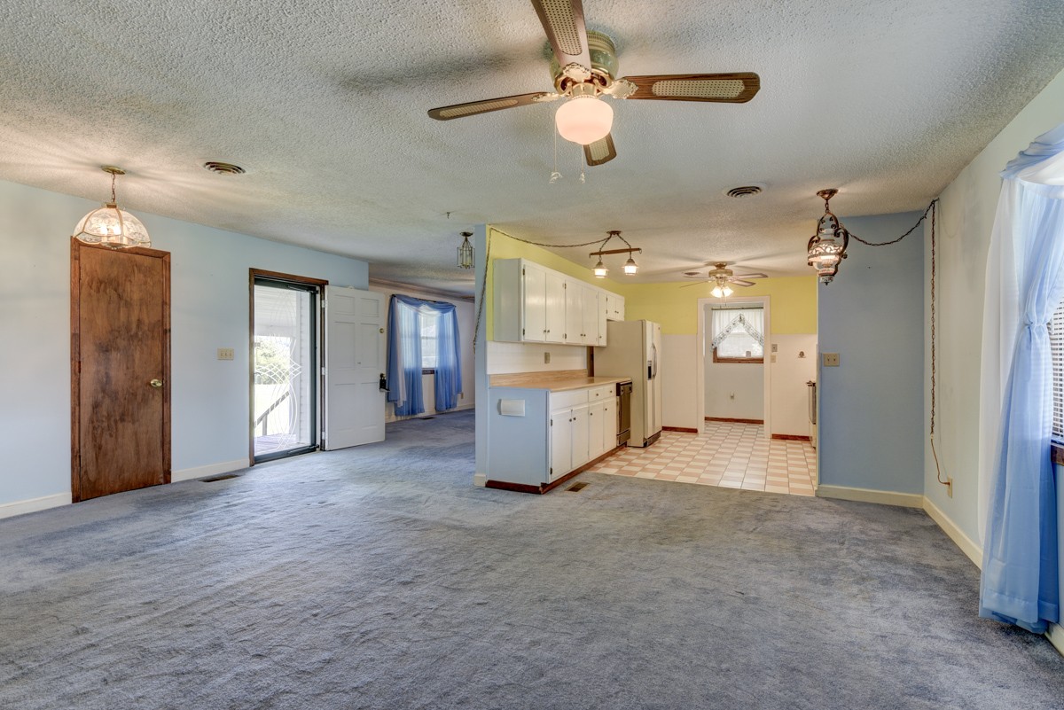 3945 Mitchell Road Lebanon, TN 37087 - Photo 17 of 41 a view of a big room with a chandelier fan and windows