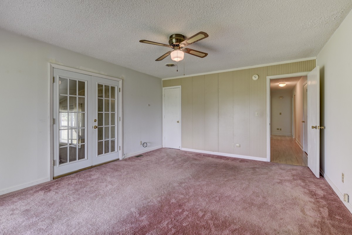3945 Mitchell Road Lebanon, TN 37087 - Photo 19 of 41 a view of a livingroom with a ceiling fan and window