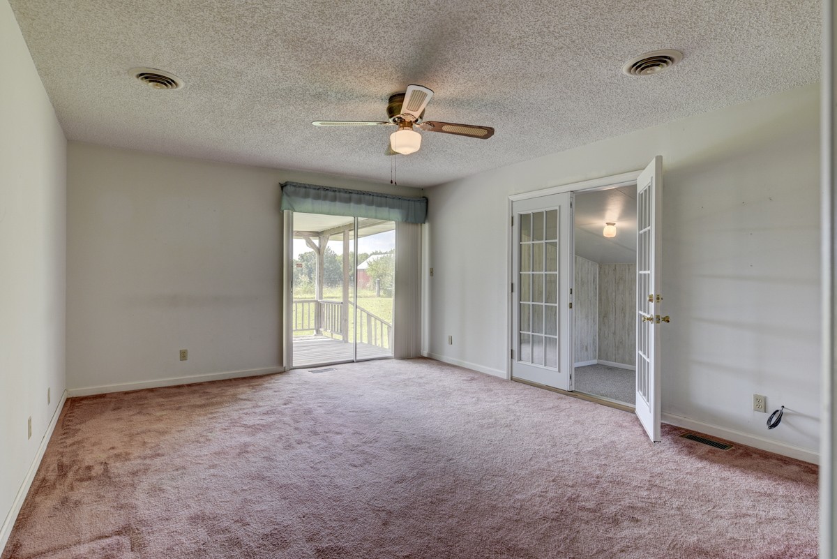 3945 Mitchell Road Lebanon, TN 37087 - Photo 21 of 41 an empty room with chandelier fan and windows