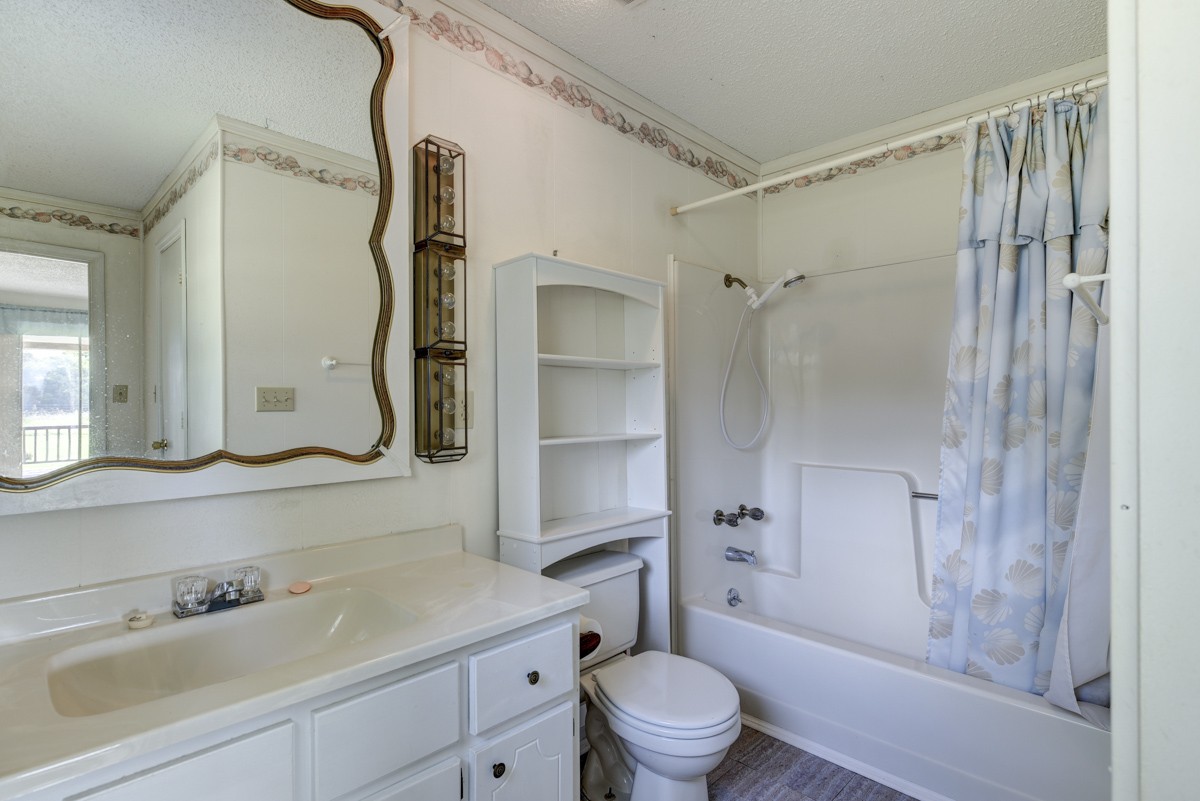 3945 Mitchell Road Lebanon, TN 37087 - Photo 27 of 41 a bathroom with a sink toilet tub and shower