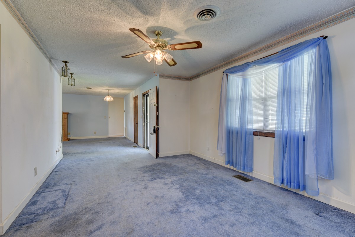 3945 Mitchell Road Lebanon, TN 37087 - Photo 34 of 41 a view of an empty room with a chandelier fan