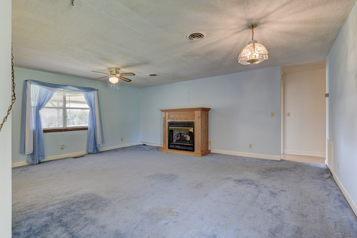 3945 Mitchell Road Lebanon, TN 37087 - Photo 35 of 41 an empty room with windows and fireplace