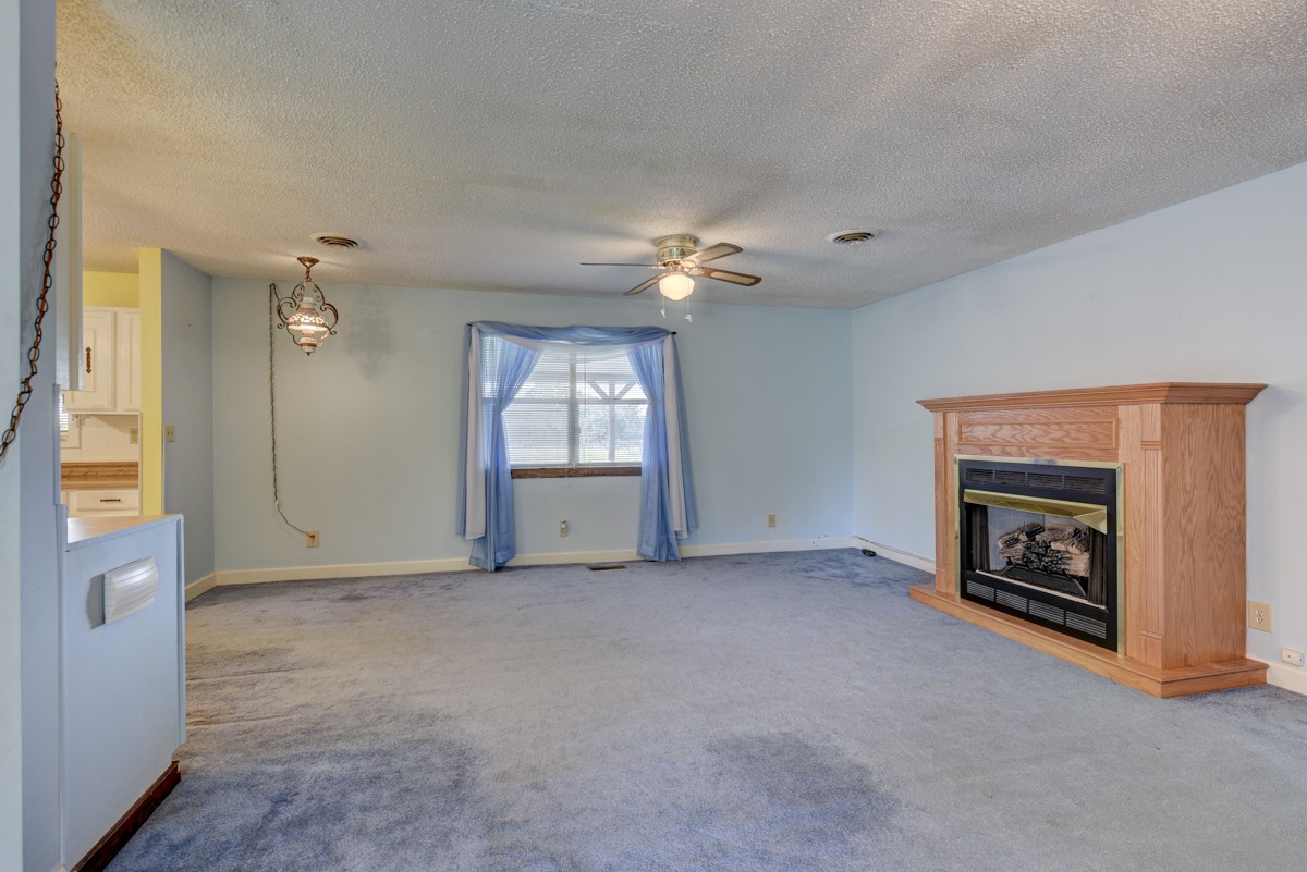 3945 Mitchell Road Lebanon, TN 37087 - Photo 36 of 41 an empty room with windows cabinet and fireplace